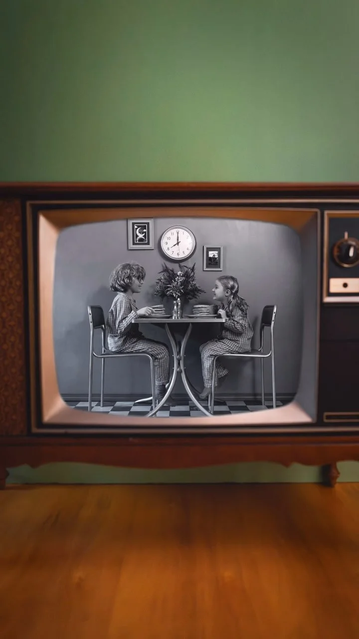 We transported our kids into a real life vintage TV! 📺😳 #LysolPartner 

For this photo, we wanted to create a real life black and white movie scene, captured entirely in camera through an old TV, so we painted our pink photo set gray, reused a checkered floor from another past photo, and went searching for some antique props. We found an old TV, table, chairs, frames, and a vase. The vintage TV had been turned into a pet bed, so we took the back out of it, cleaned it, disinfected it with @lysol Disinfectant Spray, and cut a TV sized hole out of a foam board to make it look like a wall. After that, we painted the rest of the props gray, and then it was time for the photo! We covered Oliver and Eloise from head to toe in gray makeup and hair spray 😅, Nick handled the behind the scenes filming, and I captured the photo. We couldn’t believe how real the set looked through the TV, and the kids said this is their new favorite photo ever 🥹. With our kids in school and so many germs going around this winter, Lysol Disinfectant Spray has been my go-to for disinfecting surfaces and helping to keep those germs away, including the vintage props we find for our sets! Add Lysol to your everyday routine, it’s 3x more effective at stopping the spread of germs than just cleaning alone (Vs cleaning alone, when used as directed. Tested vs leading non-disinfectant cleaner) 🫶 #LysolProtectMode
.
.
.
.
.
.
.
#behindthescenes #creativephotography #creative_portraits #creative #magical #magicofchildhood #momsofinstagram #familygoals #photoshoot #photographyart